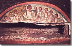 A burial niche in the Catacombs of Domitilla with a fresco of a young Chrust teaching his disciples.