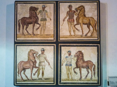 AD 3rd century mosaic showing the four, color-coded charioteer teams of the Circus Masimus.