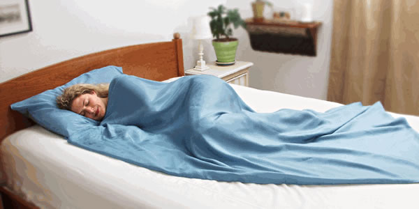 A silk sleeping bag liner for staying in hostels and making rough, cheap sheets more comfortable