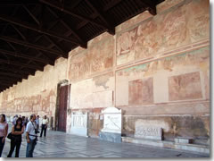 The corridors of Pisa's Camposanto are lined by Roman sarcofagi and the remains of medeival frescoes